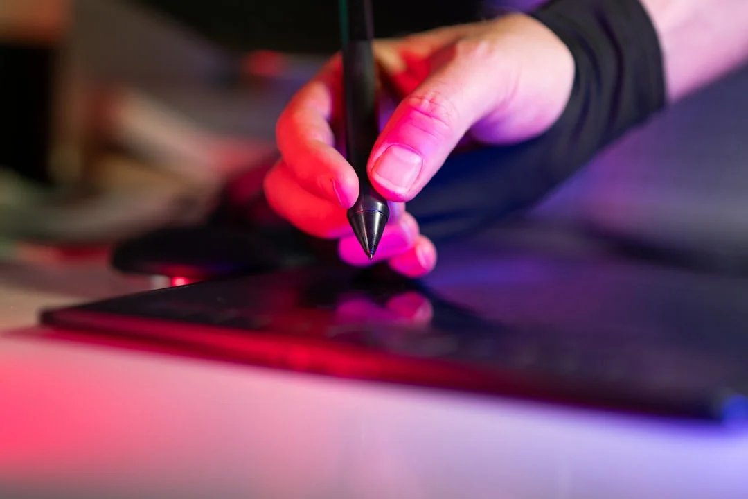 A person using a laptop to browse stock photo websites. Freelancing work in a cozy setting.